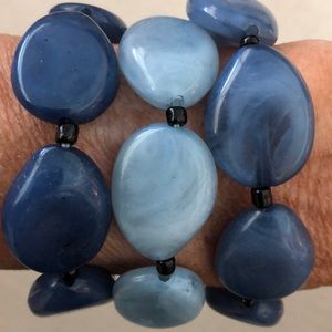 3 separate blue beaded bracelets